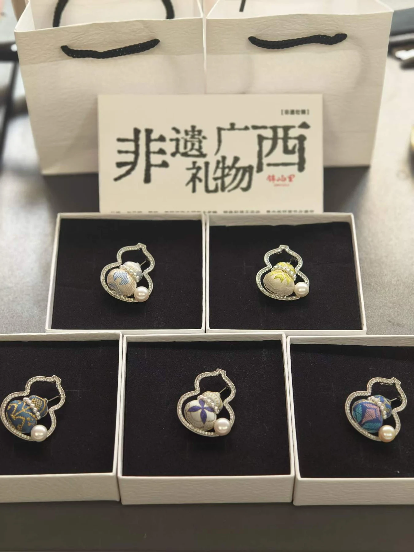 Brocade Gourd Brooch — Supplier photograph