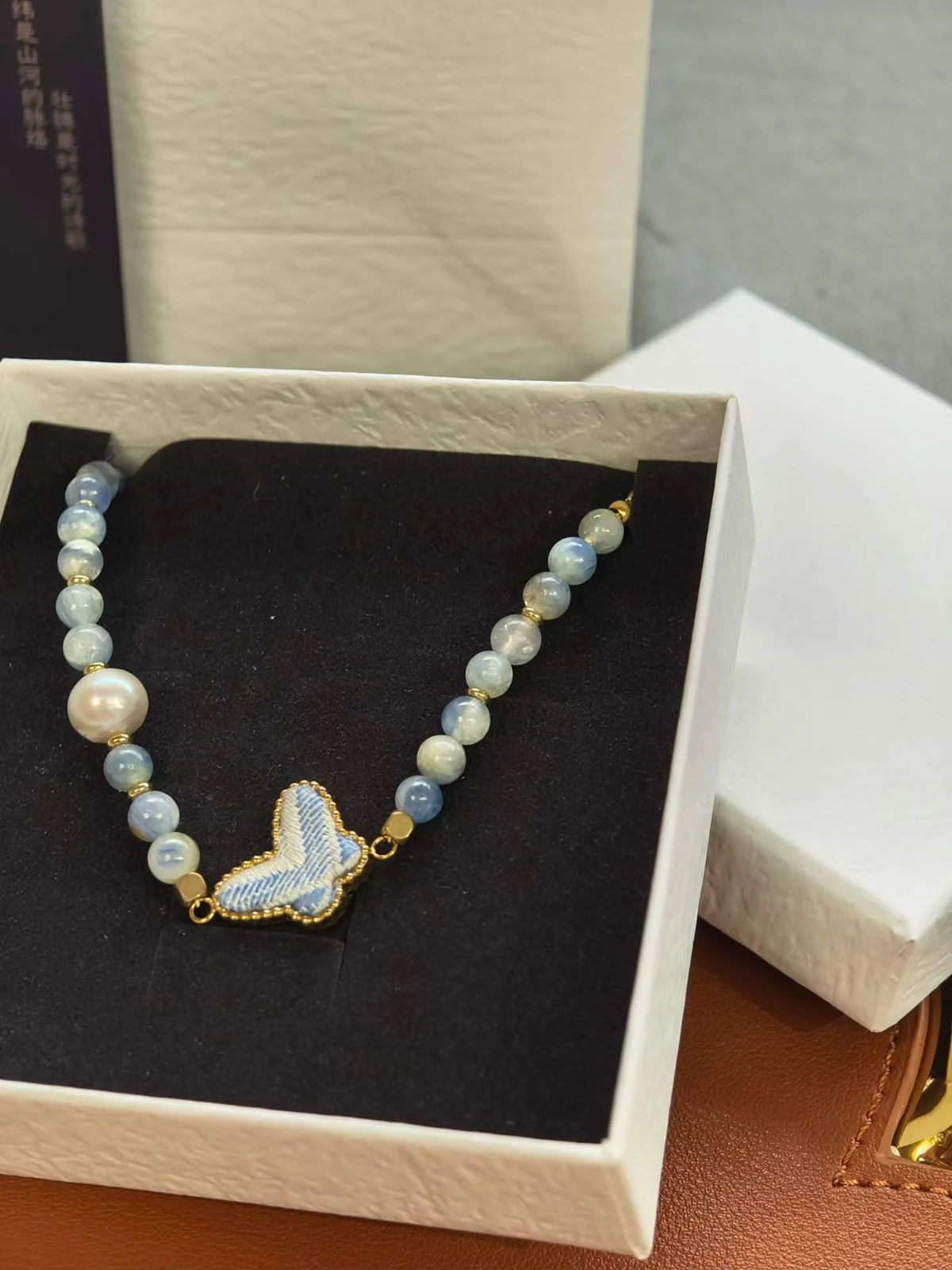 Butterfly Bead Necklace — Supplier photograph